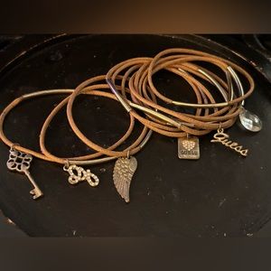 Guess brand bracelets, brown leather- 6 plain leather and 6 with guess charms